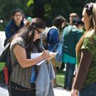 Woman signs petition at Earth Day festival