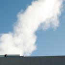 Water vapor as fluffy white plume, coming from the steam plant