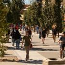Students walk and bike along the promenade