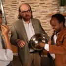 Three students show their cereal product