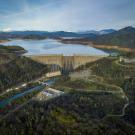 Drone image of rain-soaked Shasta Dam and mountains and streams around it