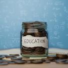 Jar of coins representing education funding