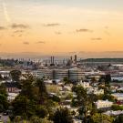 Skyliine of Richmond, California showing homes, businesses and oil and gas refinery 