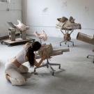 Photo of woman working on sculptures