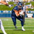 Lan Larison runs with the ball.