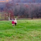 The children of UC Davis Professor Andrew Latimer run down a hill in 2007