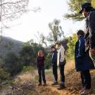 A teacher and students on a hiking trail