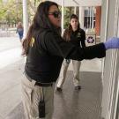 Two students check to see if door is locked.