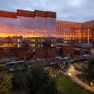 Light reflects on glass buildings at Aggie Square