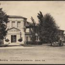 Black and white image of building with trees surrounding it