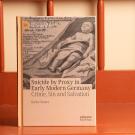 Book in sepia tones sitting on wooden chair