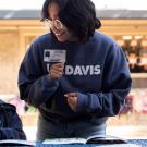 Student reads to young child