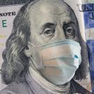 Illustration of Ben Franklin on $100 bill with a mask on.
