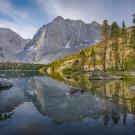 Alpine lake with backdrop of mountains in high elevations of Sequoia and Kings Canyon National Parks. 