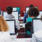 Students taking standardized tests from a screen