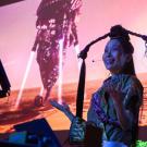 "Asian futures, without Asians" by artist Astria Suparak showing artist in front of projected image (Courtesy, Mondavi Center)