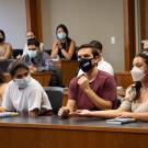 Students in masks in law school courtroom