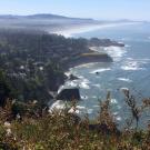 A view of coastline with cliffs receding into the distance. 