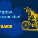Cow rides bicycle with text "Outgrow the Expected" and UC Davis logo