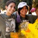 Two students make a muscle in photo; overlaid by graphic that says Celebrating 35 years of the principles of community