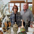 Couple in studio with colorful art pieces