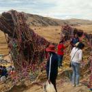 Site of a pilgrimage in Peru with people gathered around relics