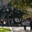 Students walk and ride bicycles outside Shields Library