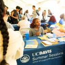 Student gets information at Summer Sessions informational table