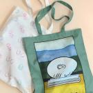 Two designs of tote bags for the Arneson Egghead Collection include pastel (with all Eggheads) and the popular "El Bookhead" design in the style of Mexican loteria cards