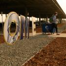 Student walks past large sign reading "HOME"