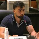 Screenshot of video shows student speaking at board meeting