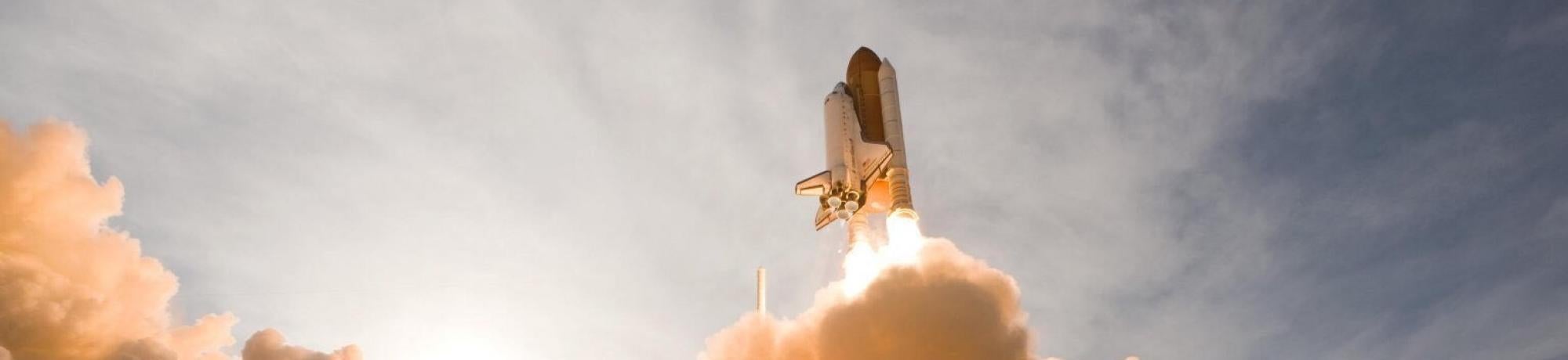 rocket launching into sky