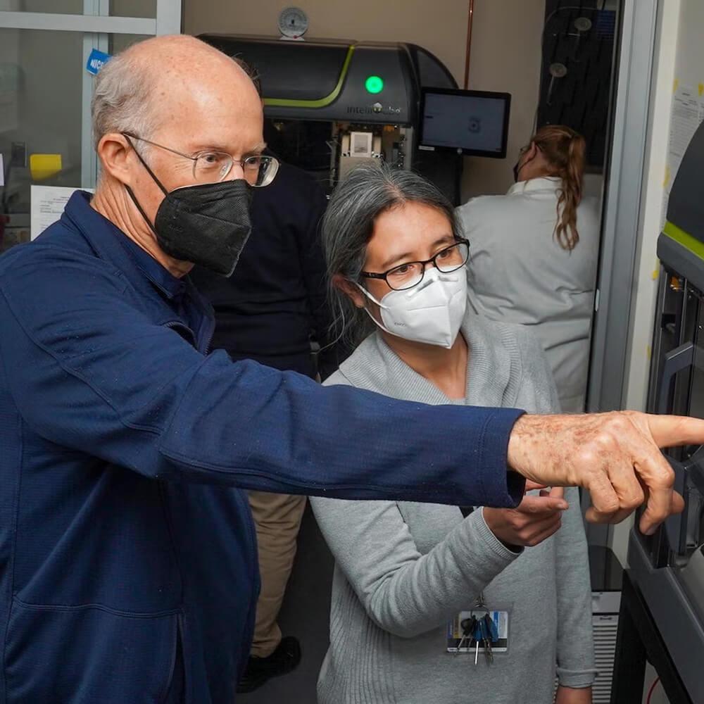 two doctors looking at research