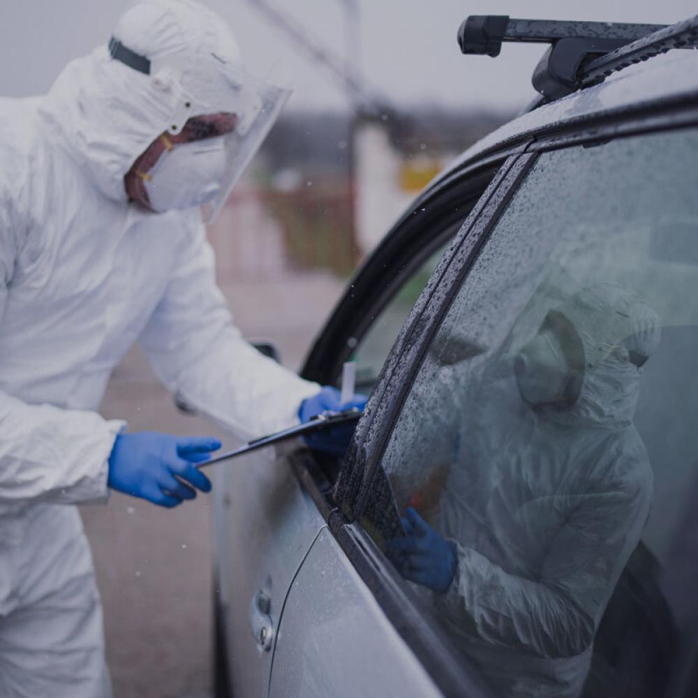 healthcare worker tests patient