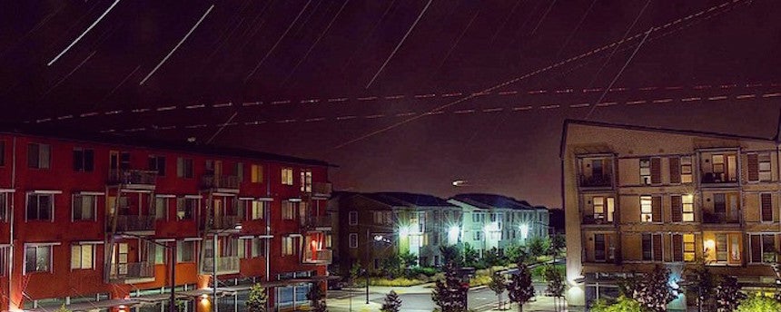 West Village apartment buildings against a night sky