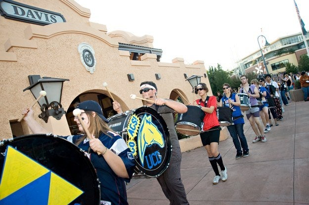 Marching band playing outside of an Amtrak train station