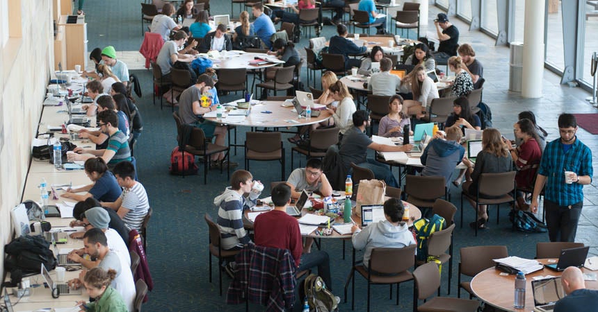 Lobby filled with students at tables and desks