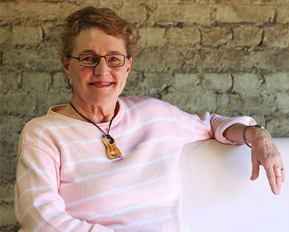 Photo of Zelma Long sitting on a bench