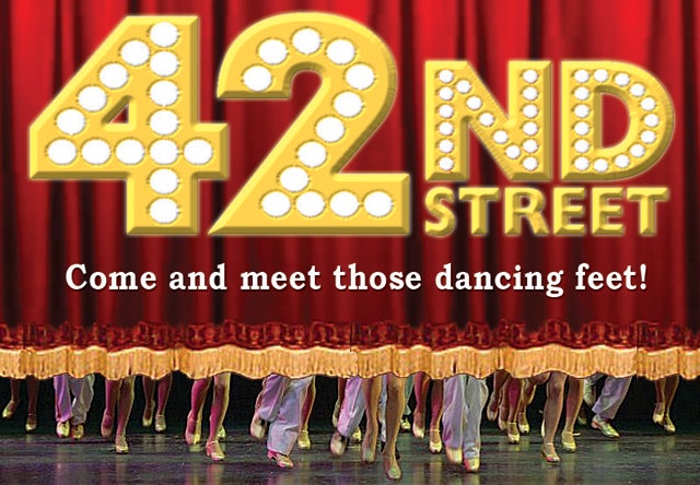 A red curtain going up to reveal dancing feet.