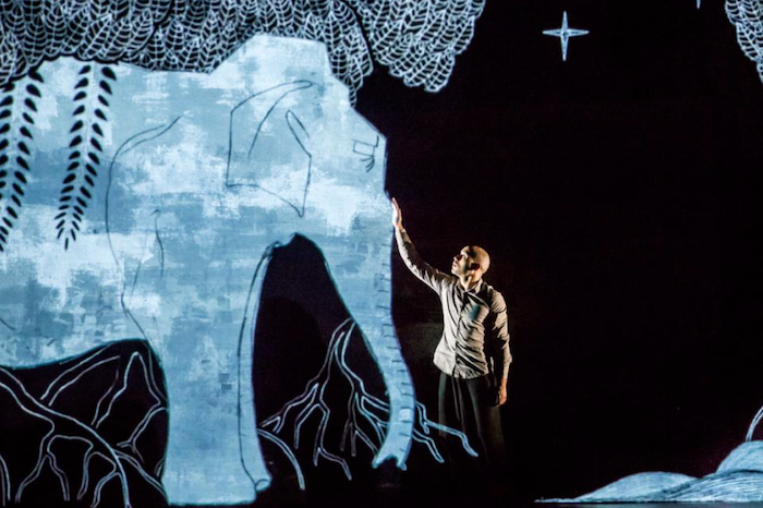 Akram Khan performing on stage.