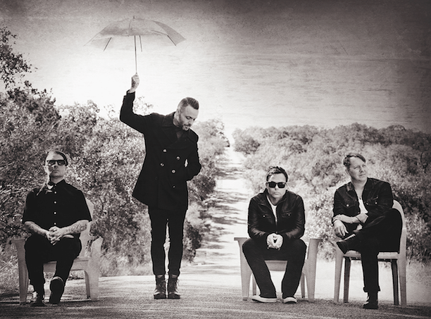 A promotional photo of the four members of the band Blue October.