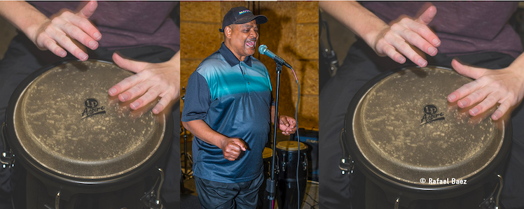 People playing drums and singing.