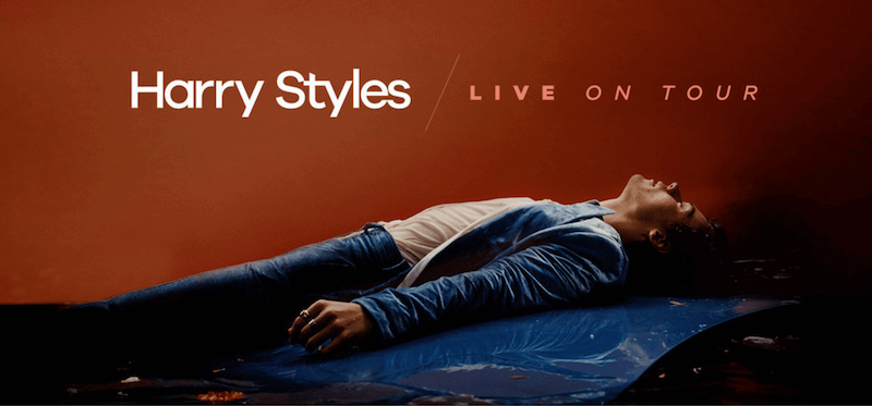 Harry Styles lying on his back with his eyes closed.