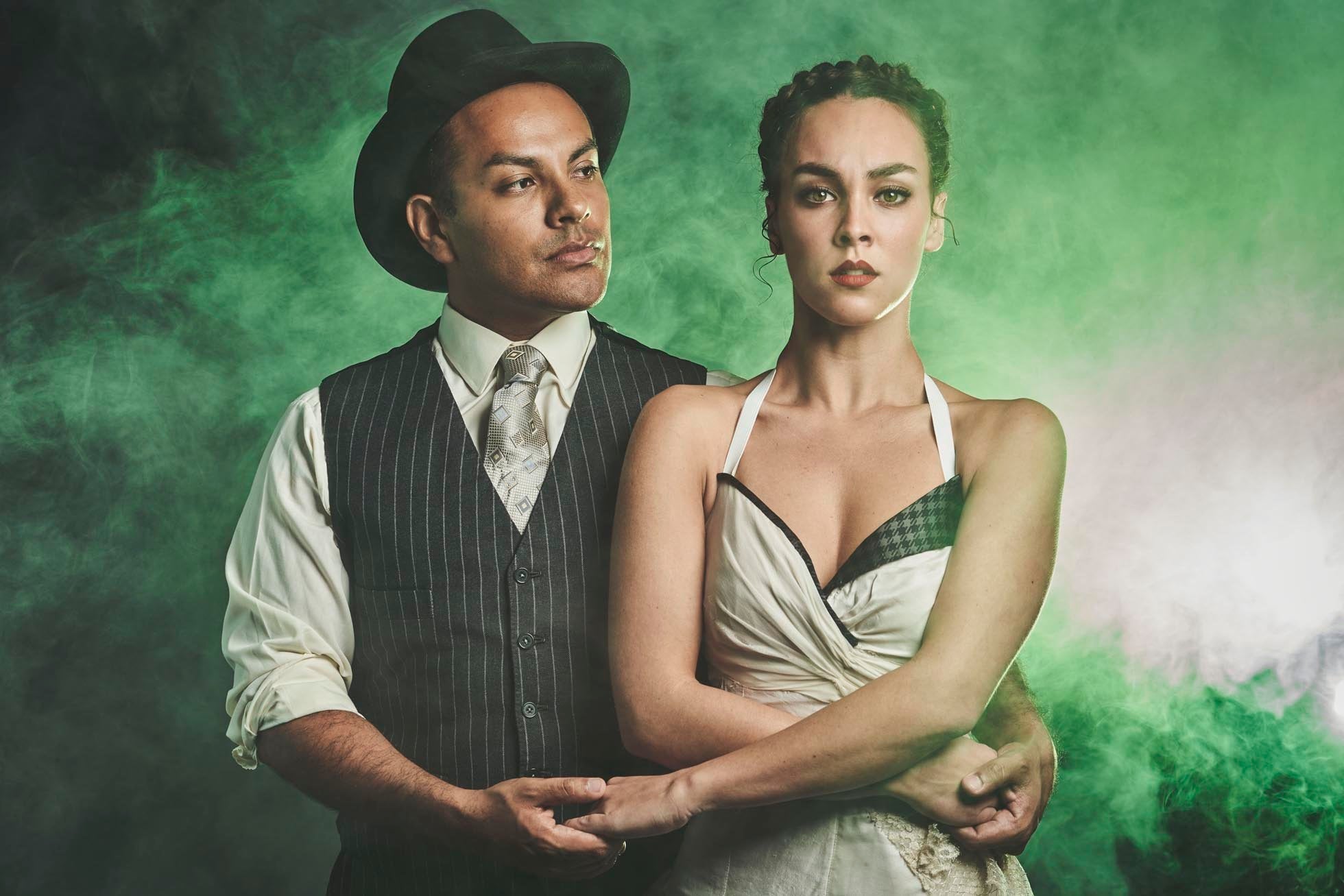 The two leads of the show wearing period garb.